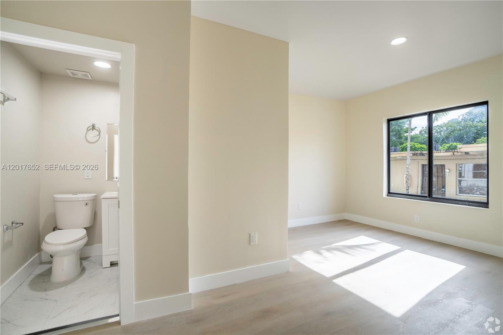 433 Southwest 6th Street, Unit 15 Miami, FL 33130 - Photo 5 of 12 a bathroom with a toilet