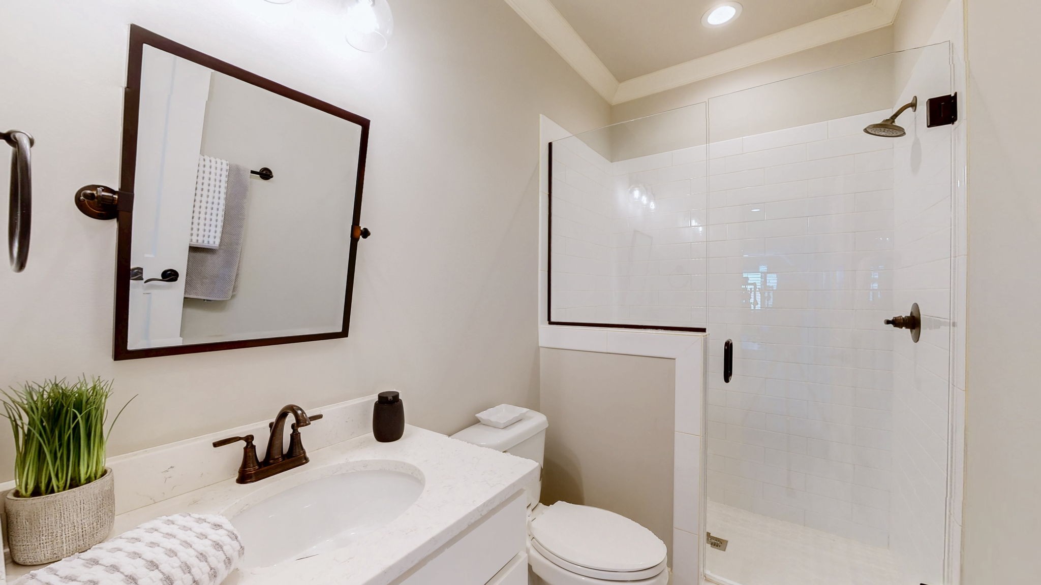 2046 Autumn Ridge Way Spring Hill, TN 37174 - Photo 36 of 65 a bathroom with a sink a toilet a mirror and shower