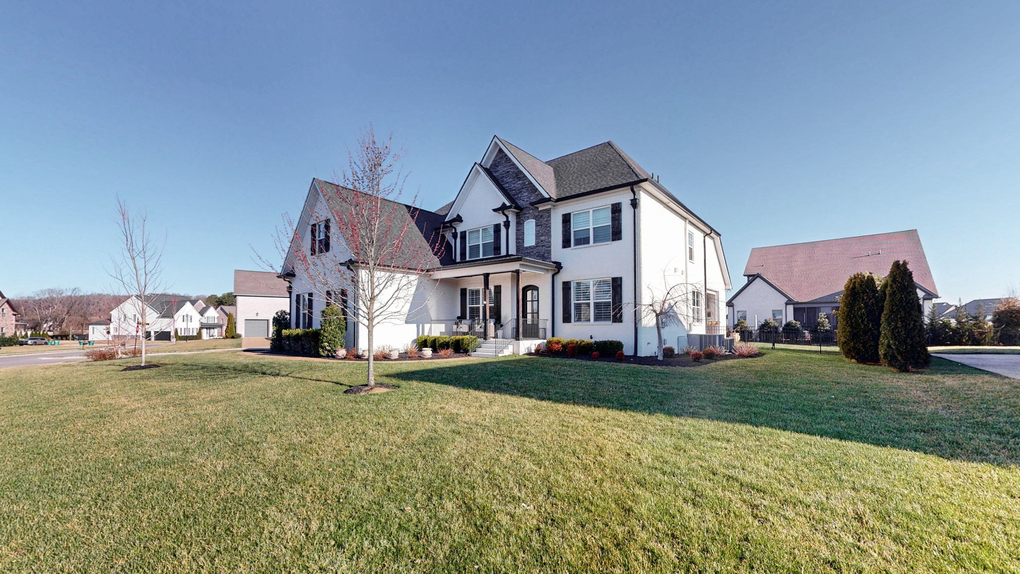 2046 Autumn Ridge Way Spring Hill, TN 37174 - Photo 4 of 65 a view of a big house with a big yard and large trees
