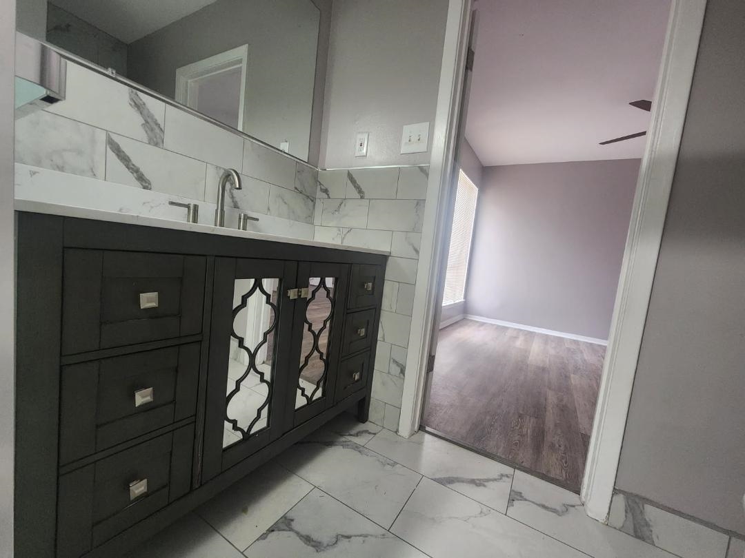 1906 Pennel Road Memphis, TN 38116 - Photo 11 of 38 a view of an empty room and wooden floor