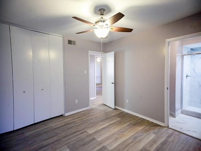 1906 Pennel Road Memphis, TN 38116 - Photo 18 of 38 a view of an empty room with wooden floor