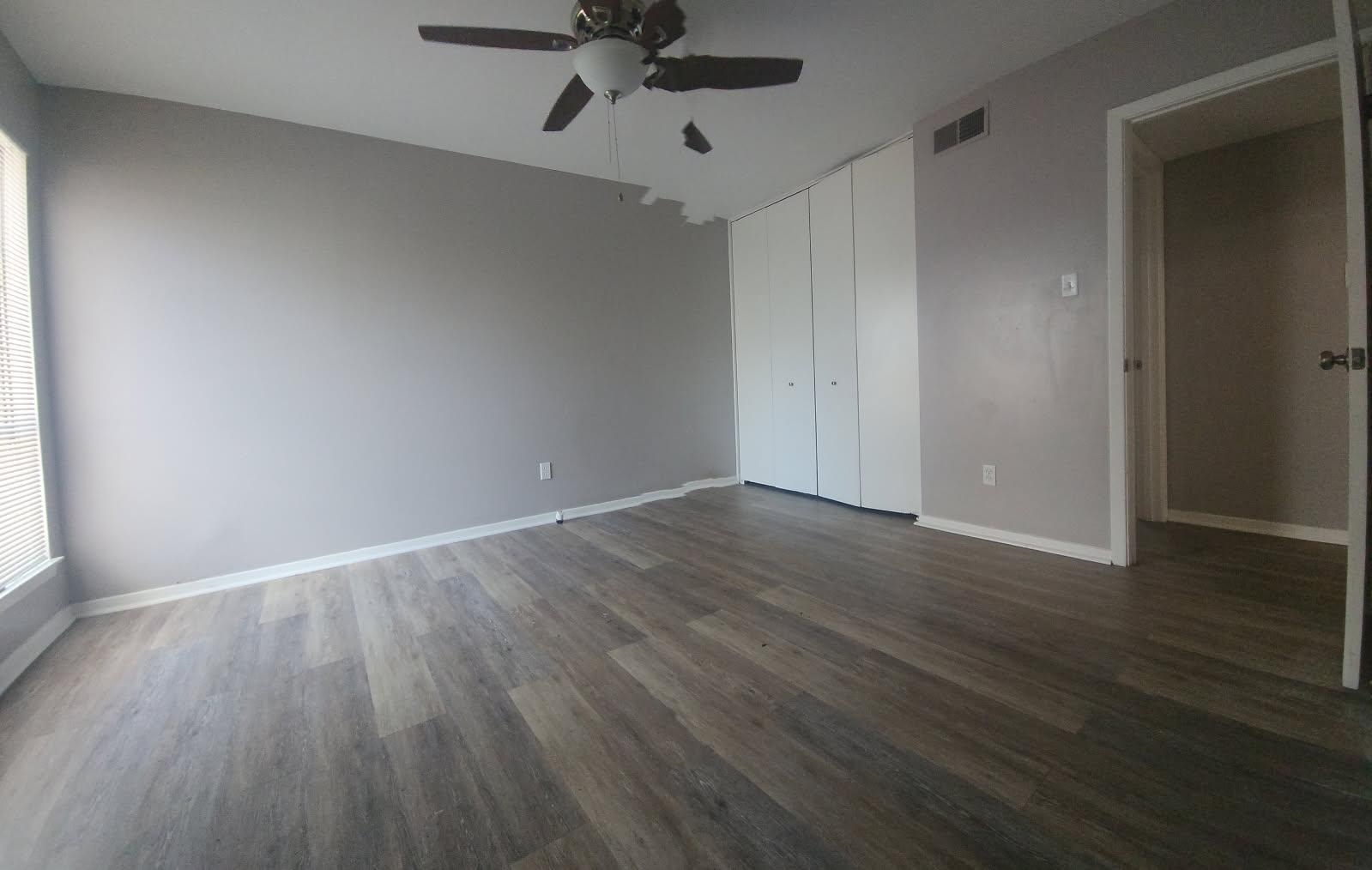 1906 Pennel Road Memphis, TN 38116 - Photo 20 of 38 a view of an empty room with wooden floor