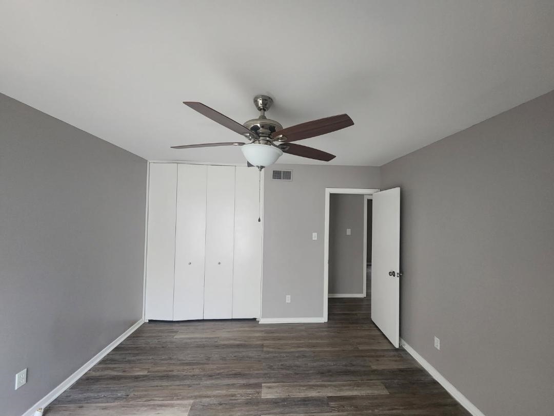 1906 Pennel Road Memphis, TN 38116 - Photo 22 of 38 a view of an empty room with wooden floor