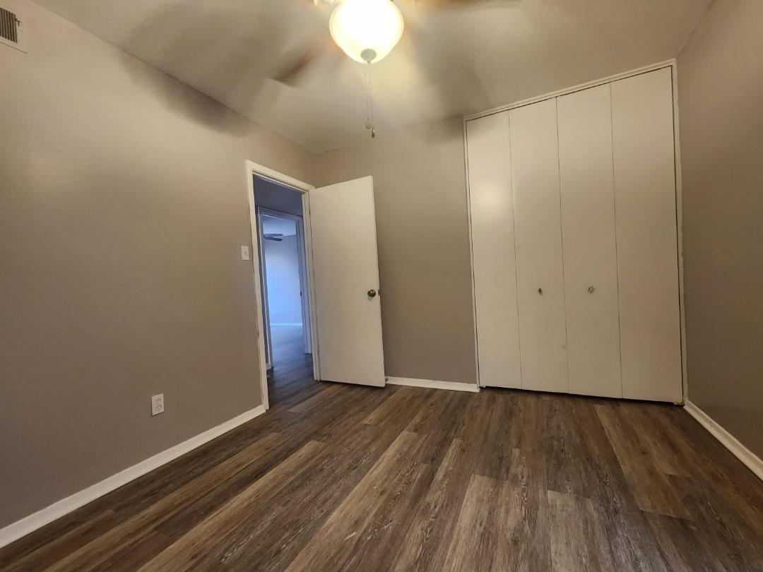 1906 Pennel Road Memphis, TN 38116 - Photo 26 of 38 a view of an empty room with wooden floor