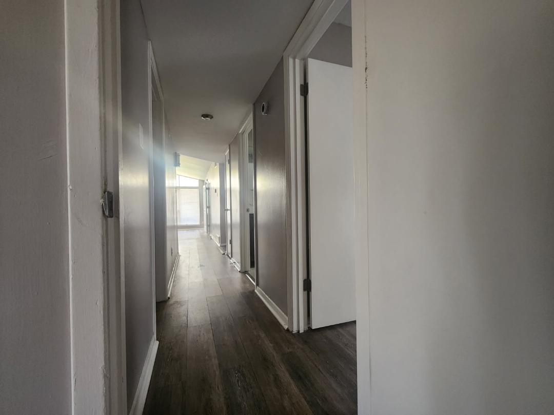 1906 Pennel Road Memphis, TN 38116 - Photo 27 of 38 a view of a hallway with wooden floor