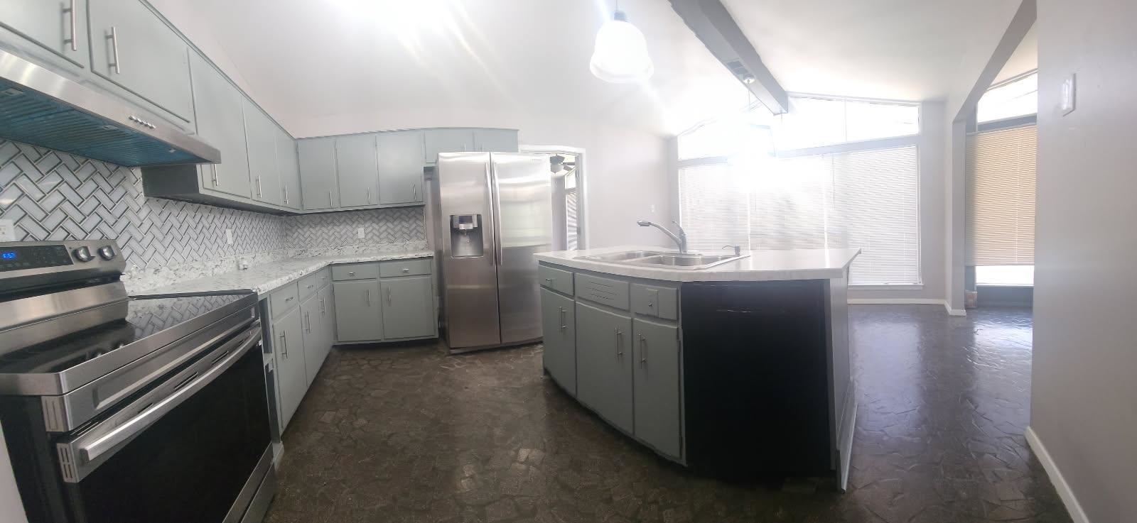 1906 Pennel Road Memphis, TN 38116 - Photo 4 of 38 a kitchen with stainless steel appliances granite countertop a sink a stove a refrigerator and a window