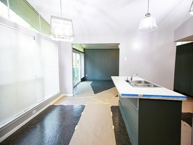 1906 Pennel Road Memphis, TN 38116 - Photo 6 of 38 a kitchen with a sink a refrigerator and wooden floor