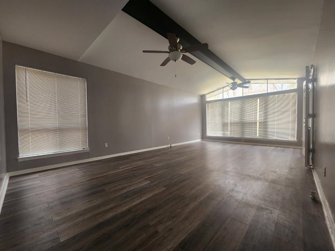1906 Pennel Road Memphis, TN 38116 - Photo 10 of 38 an empty room with wooden floor and windows