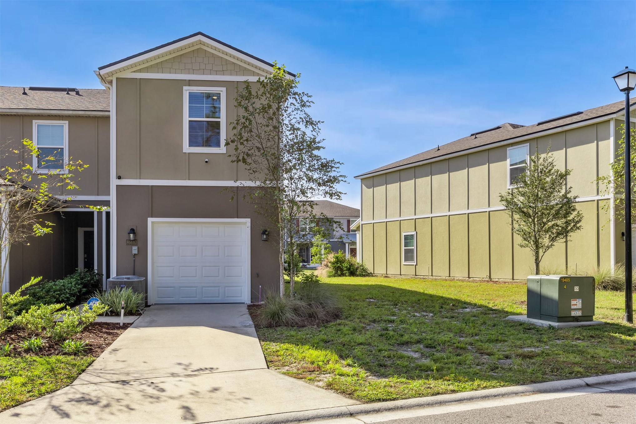 86440 Shortline Circle Yulee, FL 32097 - Photo 7 of 50 a front view of a house with garden