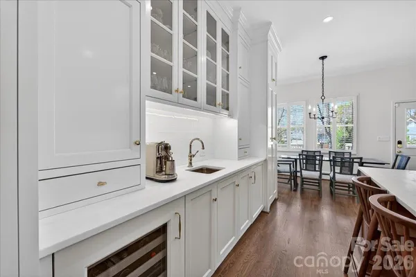 a kitchen with cabinets and window