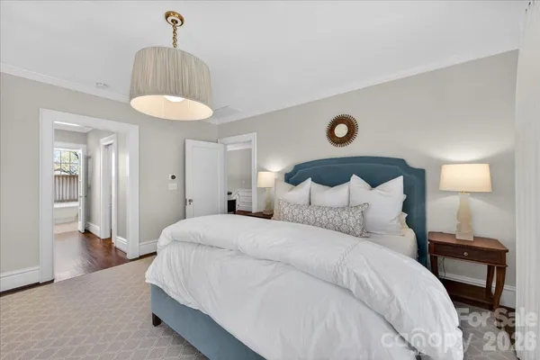 a bedroom with a bed and a table