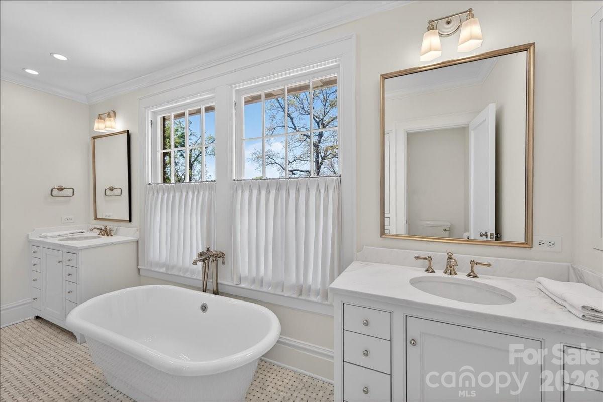700 Queens Road Charlotte, NC 28207 - Photo 28 of 41 a bathroom with a sink and a mirror