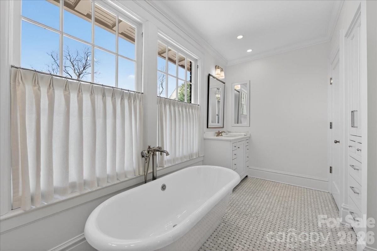 700 Queens Road Charlotte, NC 28207 - Photo 29 of 41 a bathroom with a bathtub and shower
