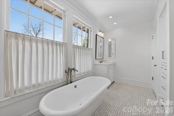 a bathroom with a bathtub and shower