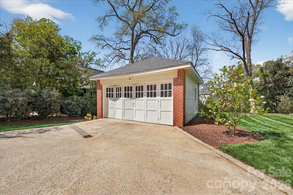 700 Queens Road Charlotte, NC 28207 - Photo 40 of 41 a view of a house with a yard and garage