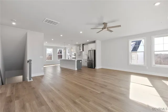 a view of a kitchen with a sink and a window
