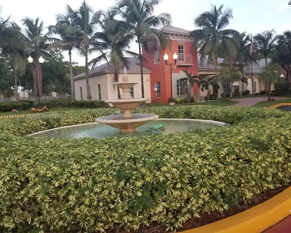 a view of a building with a yard