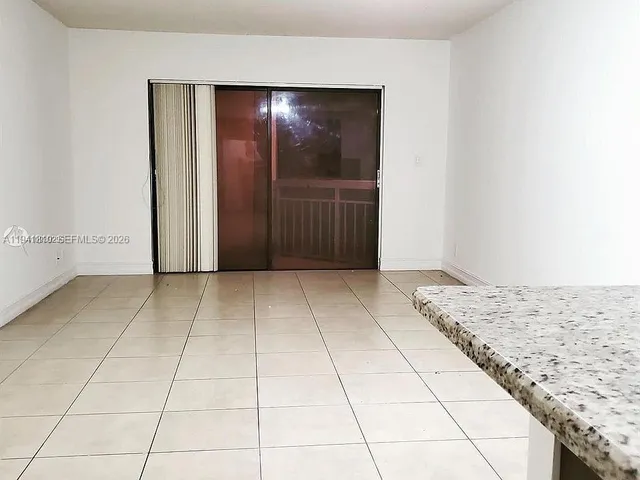 a view of hallway with wooden floor