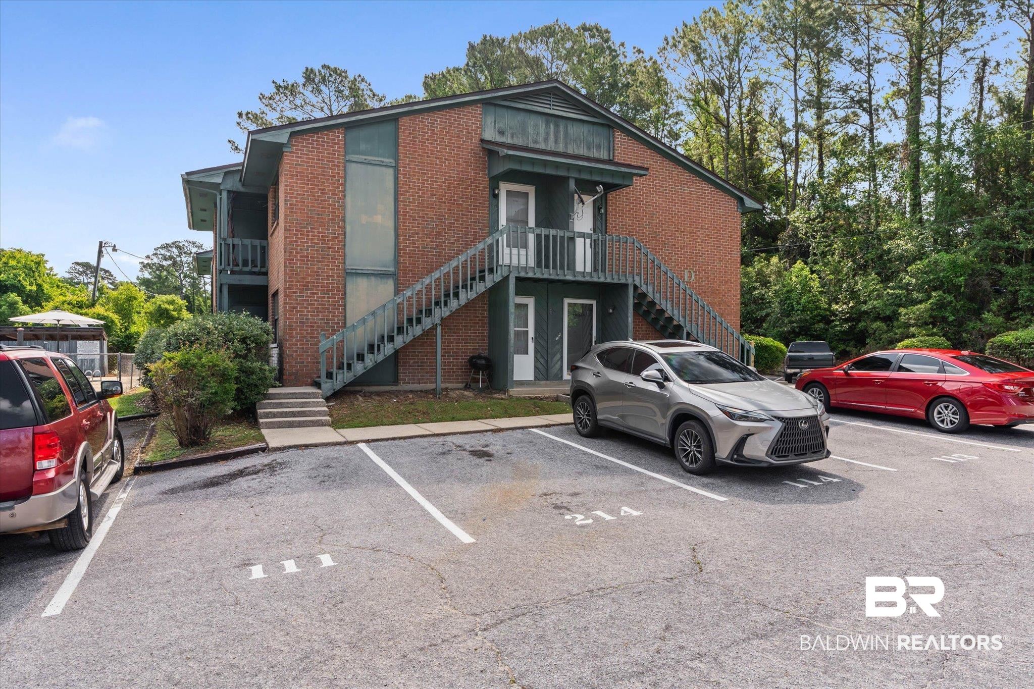 500 Grant Street, Unit D213 Daphne, AL 36526 - Photo 1 of 6 Brick exterior with contrasting green trim and railings