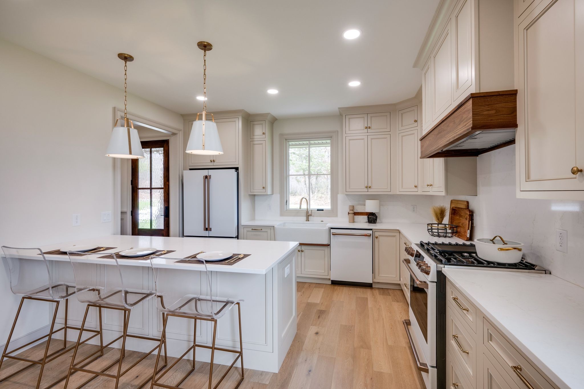 924 Hafner Road Charlotte, TN 37036 - Photo 12 of 79 a kitchen that has a lot of white cabinets and stainless steel appliances