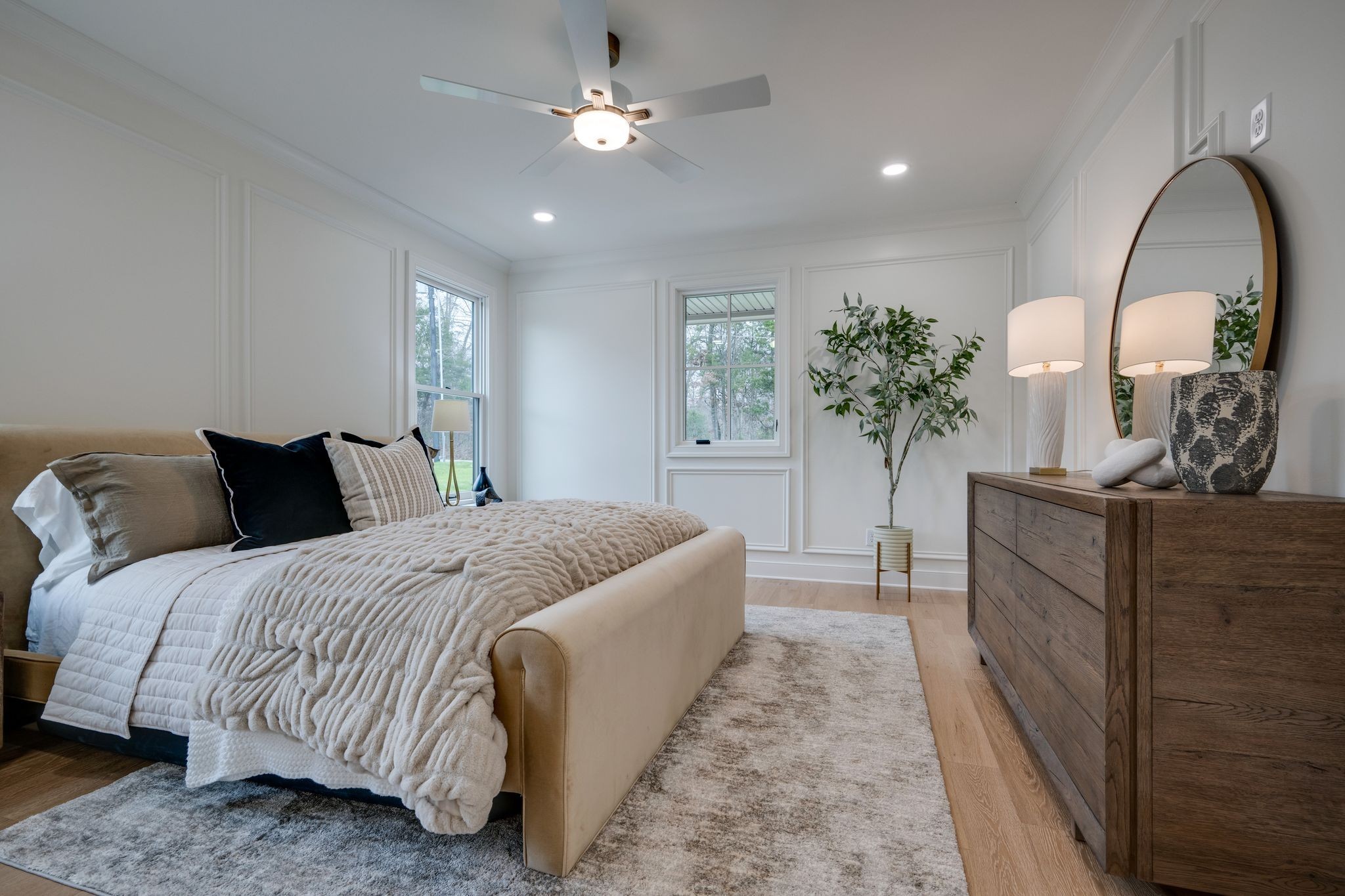 924 Hafner Road Charlotte, TN 37036 - Photo 31 of 79 a spacious bedroom with a bed and a potted plant