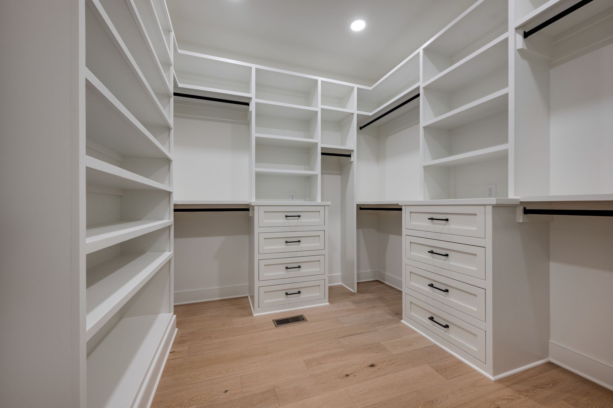 924 Hafner Road Charlotte, TN 37036 - Photo 35 of 79 a view of walk in closet with empty racks