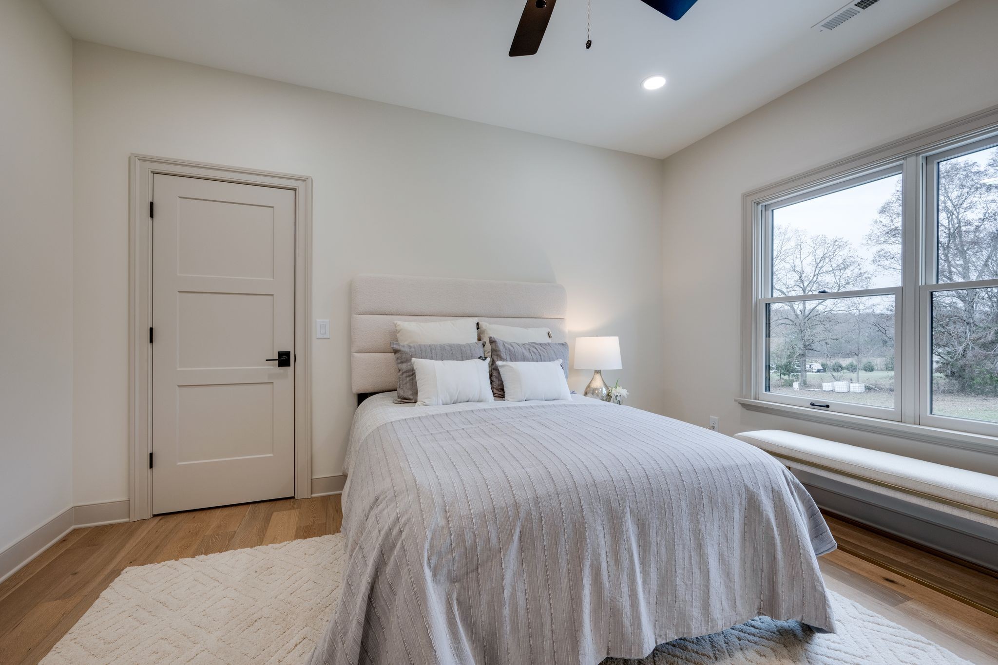 924 Hafner Road Charlotte, TN 37036 - Photo 43 of 79 a bedroom with a bed and a large window