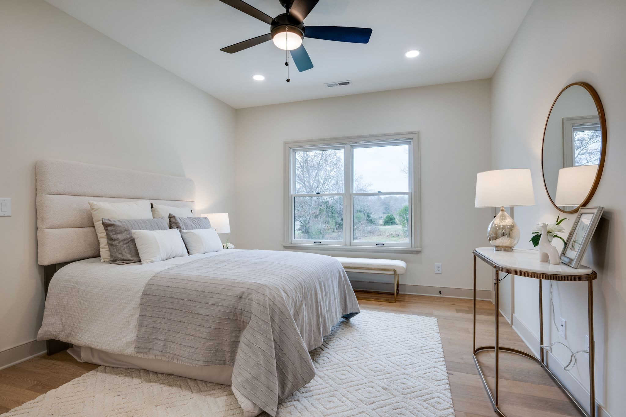 924 Hafner Road Charlotte, TN 37036 - Photo 47 of 79 a bedroom with a bed a chandelier and mirror