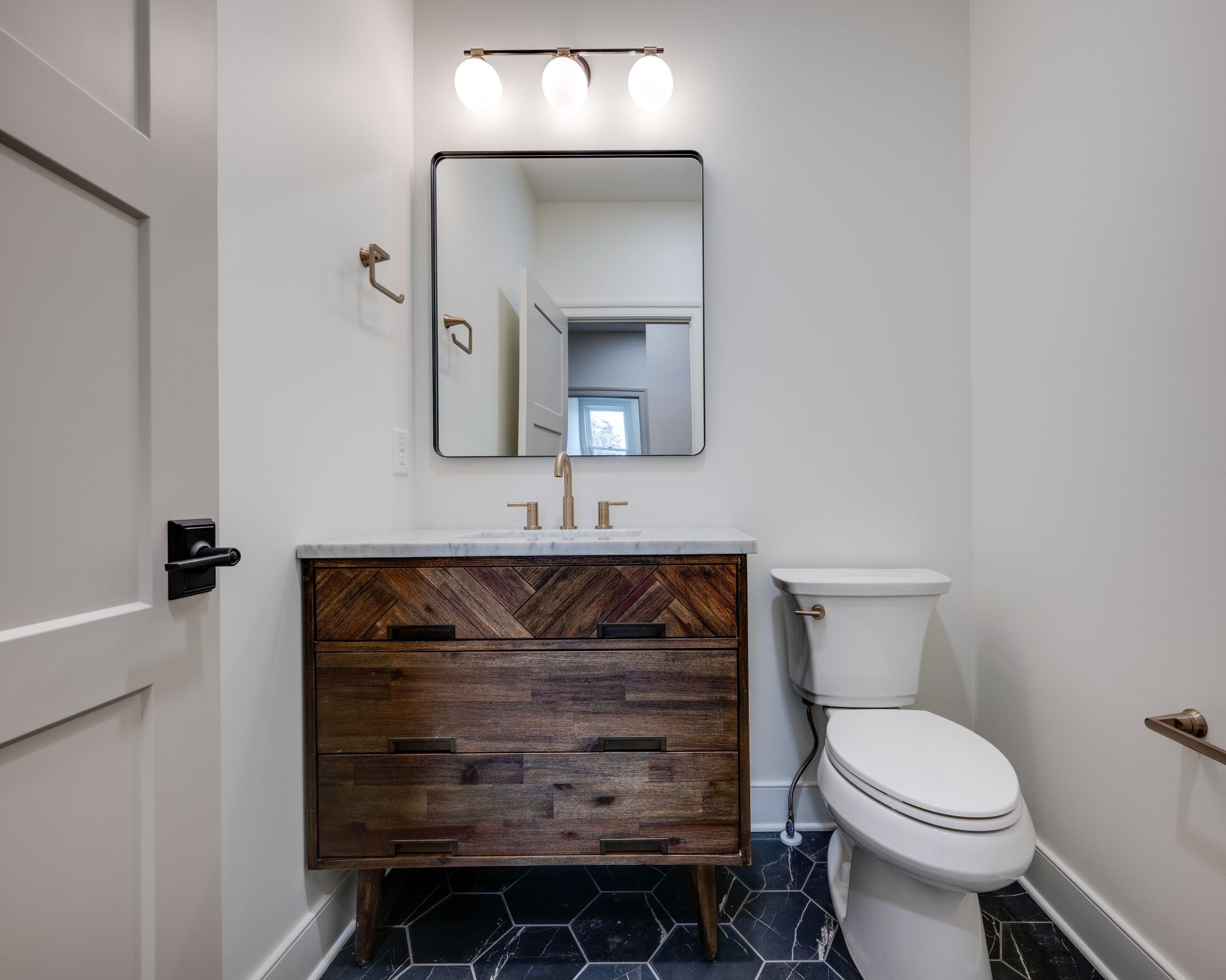 924 Hafner Road Charlotte, TN 37036 - Photo 54 of 79 a bathroom with a toilet sink and mirror