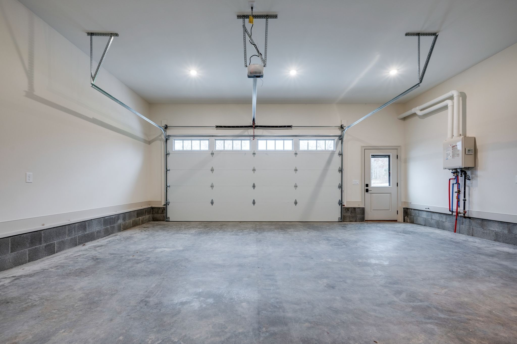 924 Hafner Road Charlotte, TN 37036 - Photo 60 of 79 an empty room with ceiling fan and windows