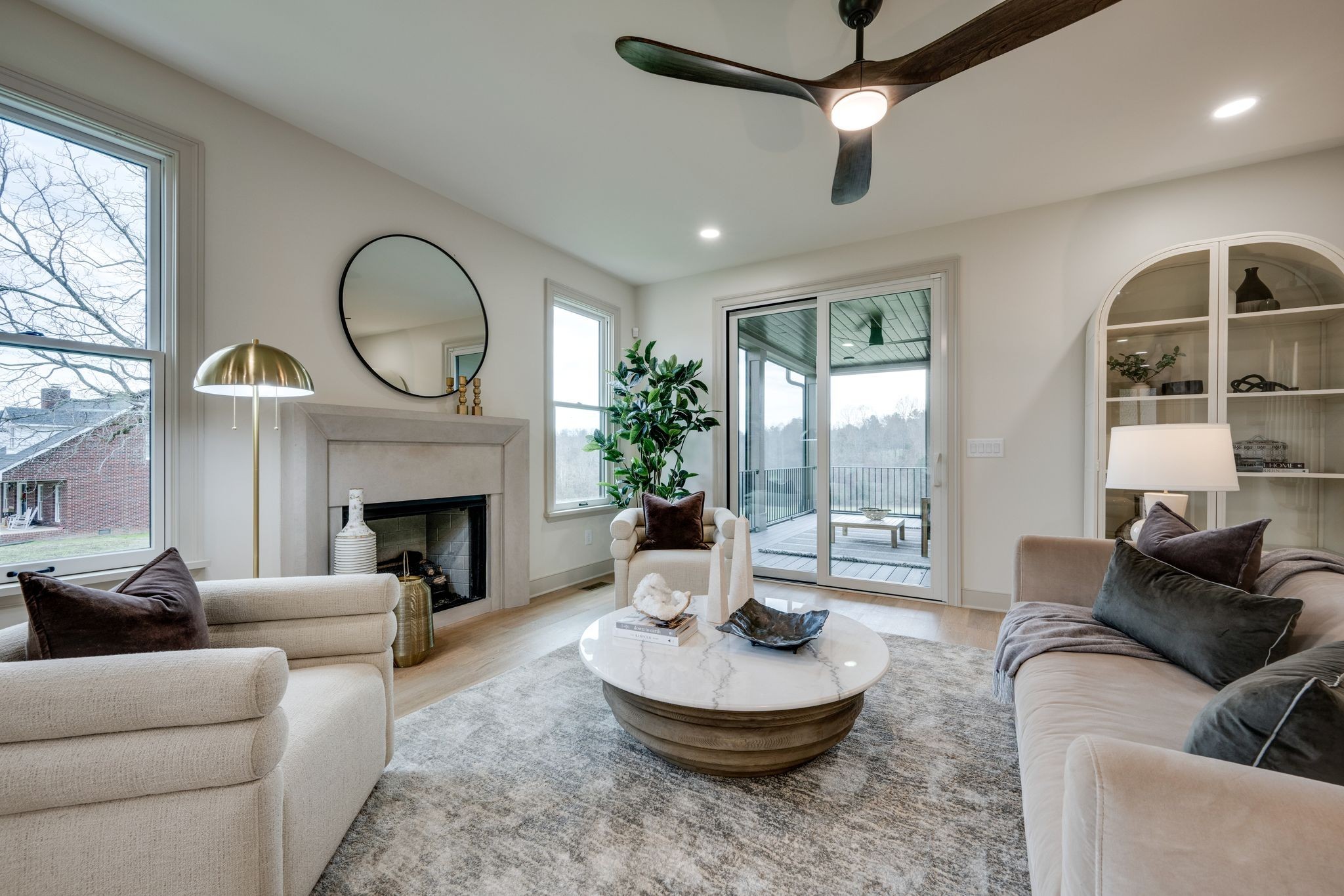 924 Hafner Road Charlotte, TN 37036 - Photo 7 of 79 a living room with furniture a fireplace and a large window