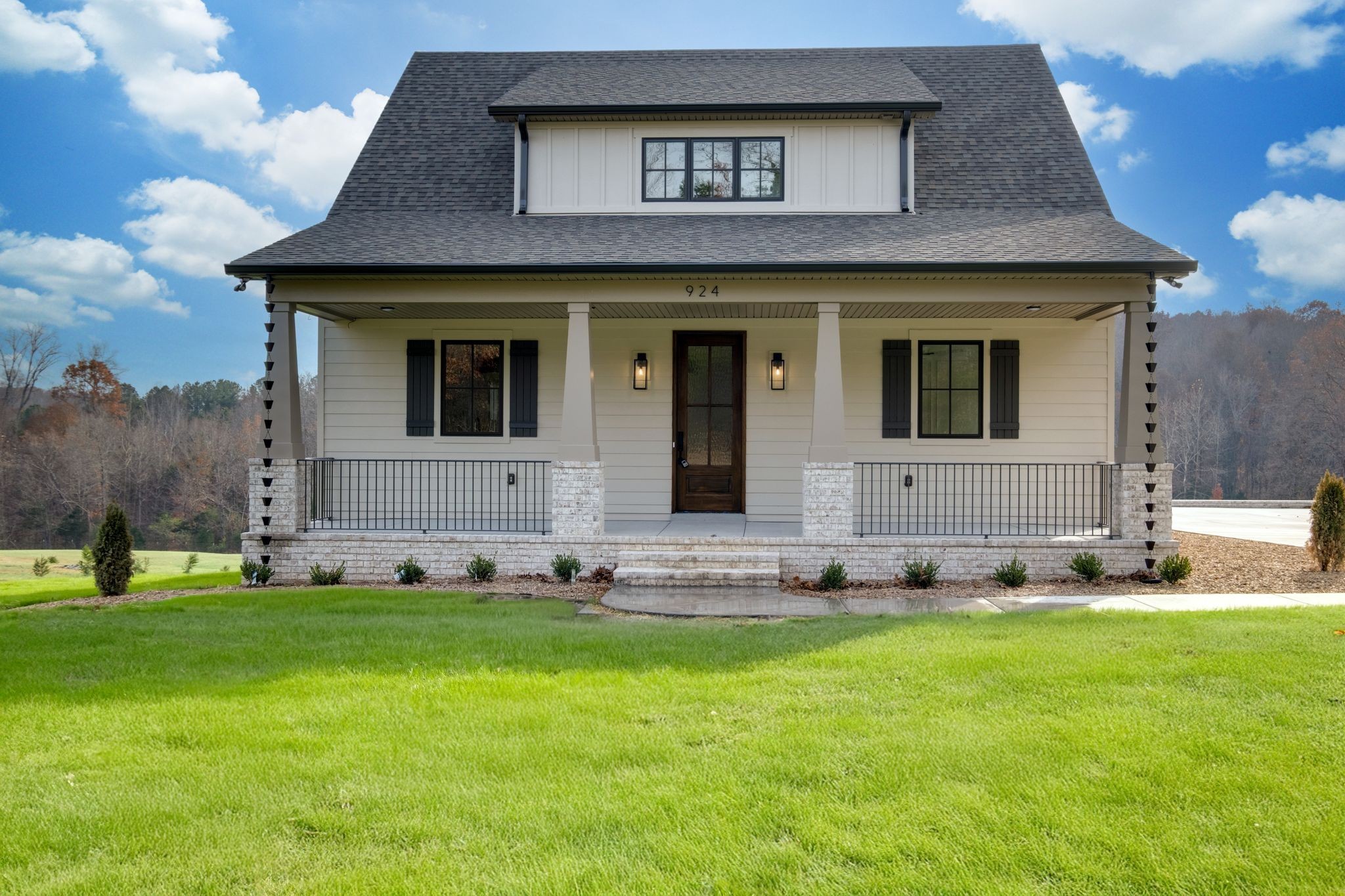 924 Hafner Road Charlotte, TN 37036 - Photo 77 of 79 a front view of a house with a yard and garage