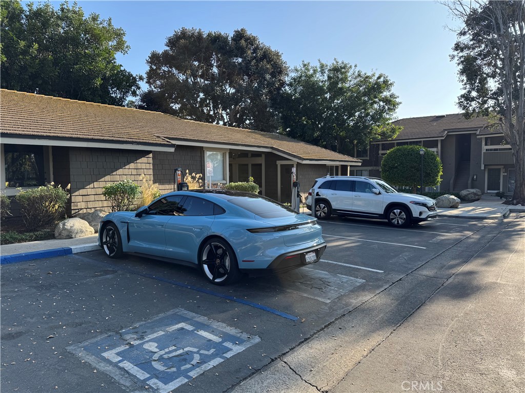 211 Springview Irvine, CA 92620 - Photo 9 of 12 a car parked in front of a house