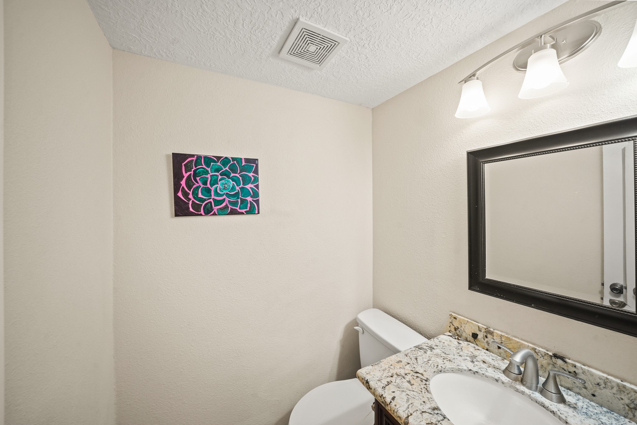 1641 Beaconshire Houston, TX 77077 - Photo 11 of 27 This well-appointed half bathroom is great for when you have family, friends, and guests over.