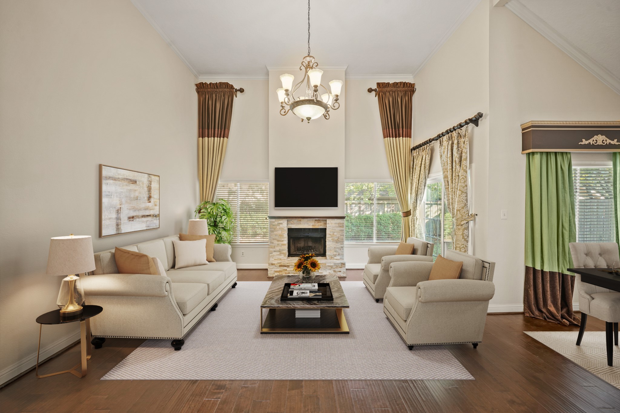 1641 Beaconshire Houston, TX 77077 - Photo 15 of 27 Virtually Staged: This stunning living room features soaring ceilings, rich wood flooring, and an abundance of natural light streaming through large windows on both sides of the fireplace.