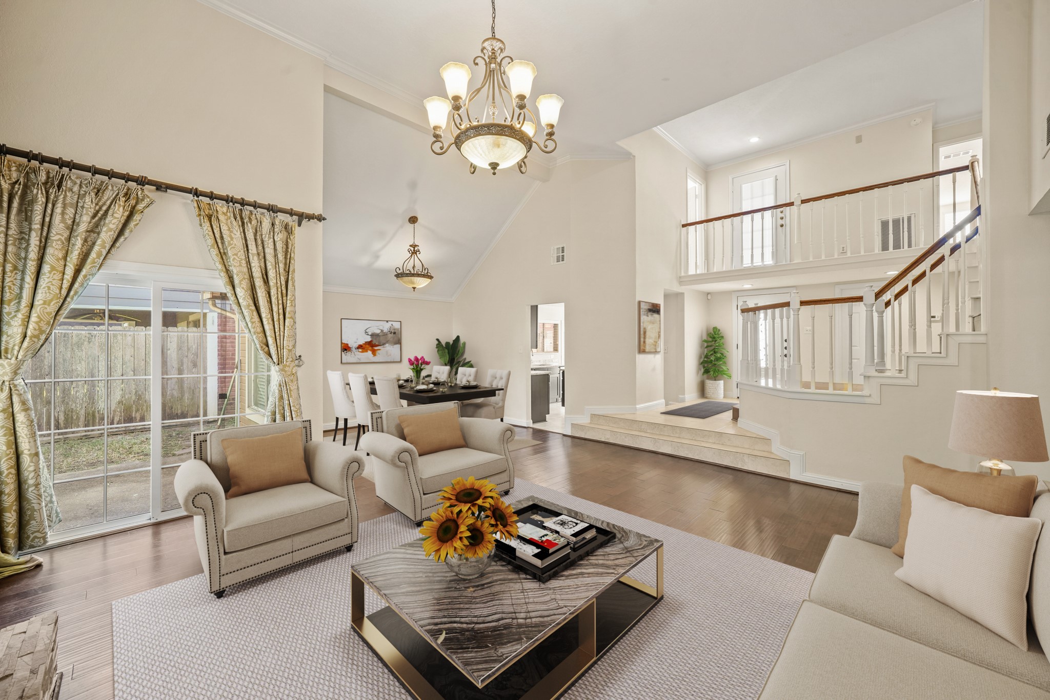 1641 Beaconshire Houston, TX 77077 - Photo 27 of 27 Virtually Staged: This beautifully designed open floor plan offers seamless connectivity between the living room, dining area, and entryway, creating a bright and spacious layout that’s perfect for everyday living and entertaining.