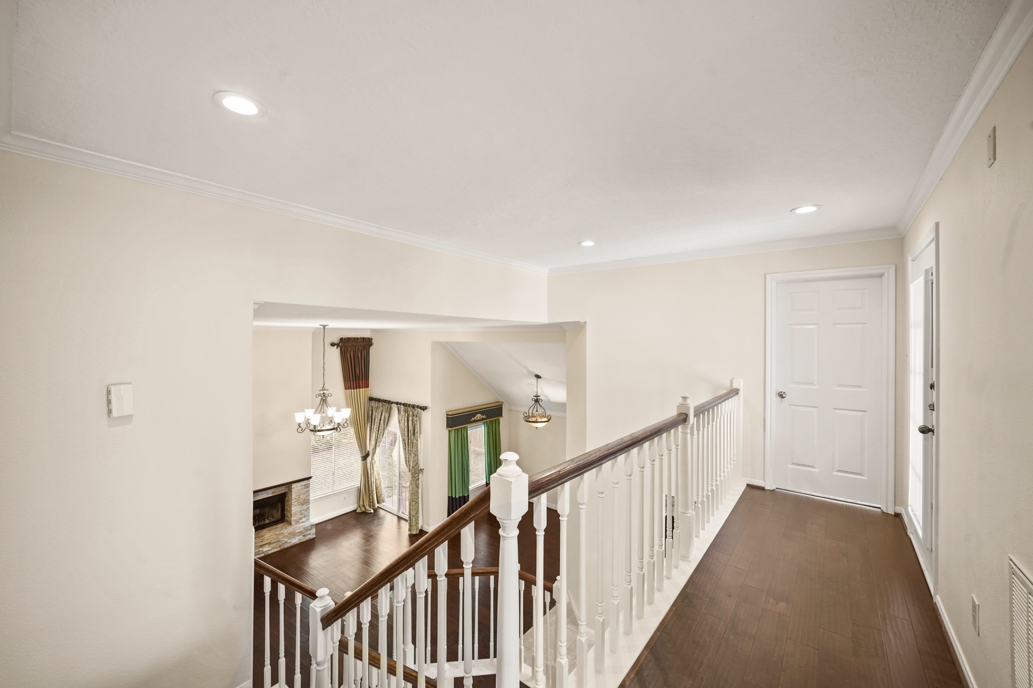 1641 Beaconshire Houston, TX 77077 - Photo 19 of 27 Take a look at your living room from the top of the second floor hallway.