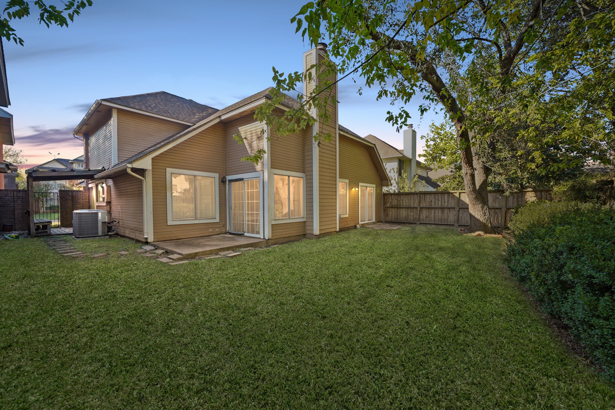 1641 Beaconshire Houston, TX 77077 - Photo 24 of 27 Welcome to your new backyard! Check out the expansive patio deck, perfect for a tasty family barbecue, and space for the kids and pets to run around in.