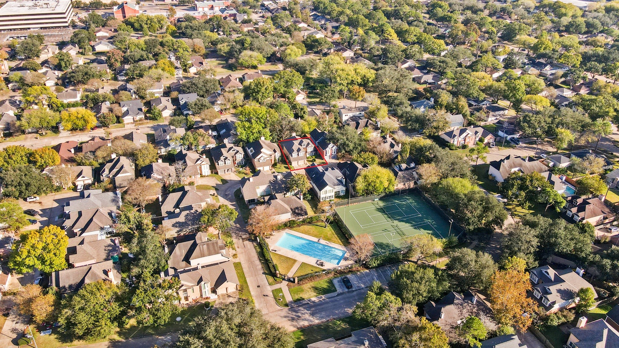 1641 Beaconshire Houston, TX 77077 - Photo 4 of 27 Just steps away, you’ll find a beautifully maintained community area featuring a large swimming pool, tennis courts, and green spaces—ideal for recreation, exercise, and gathering with neighbors. The neighborhood is filled with lush trees, winding streets, and a welcoming suburban feel, offering both privacy and convenience.