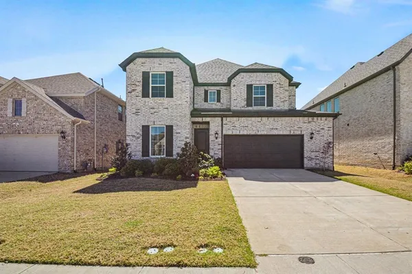 a front view of a house with yard