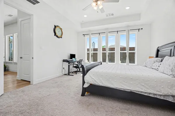 a bed room with a bed and a chair
