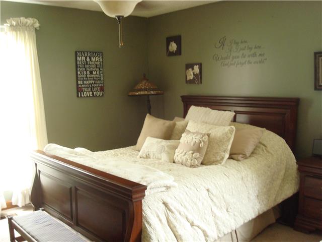 1113 Jacksons View Road Hermitage, TN 37076 - Photo 9 of 12 a bedroom with a bed and a table