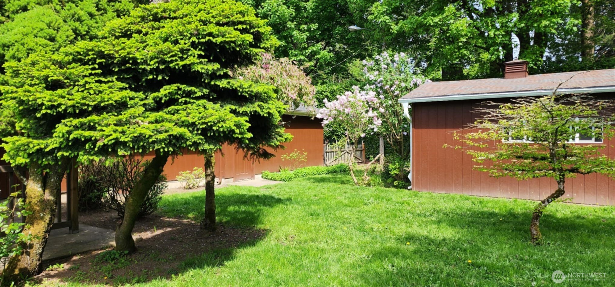 314 Insel Road Woodland, WA 98674 - Photo 12 of 32 a backyard of a house with lots of green space