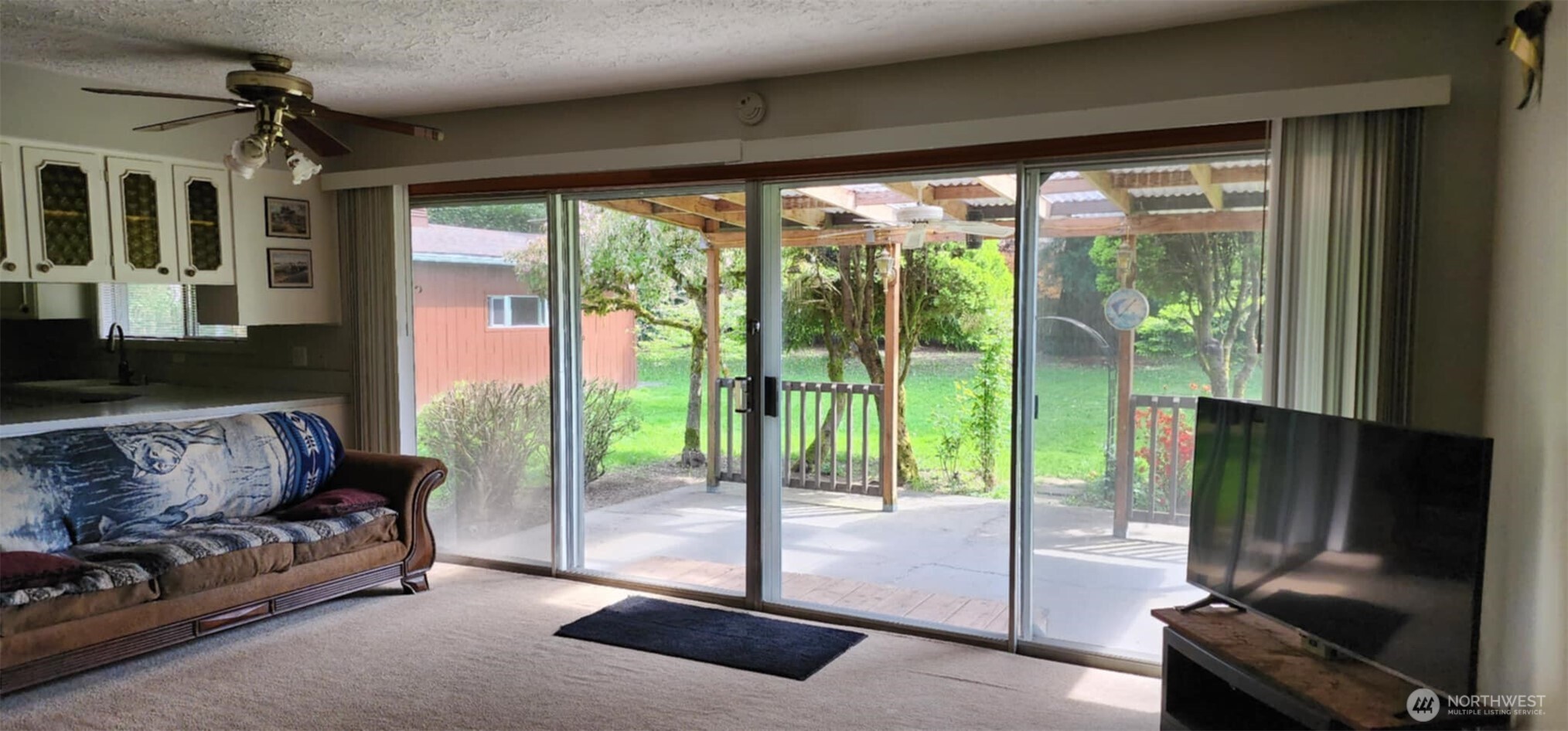 314 Insel Road Woodland, WA 98674 - Photo 18 of 32 a living room with furniture and a flat screen tv