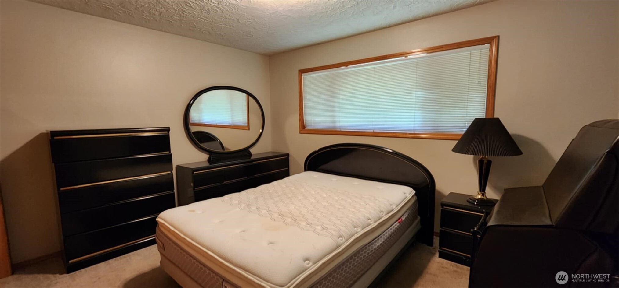 314 Insel Road Woodland, WA 98674 - Photo 24 of 32 a bedroom with a bed and dresser