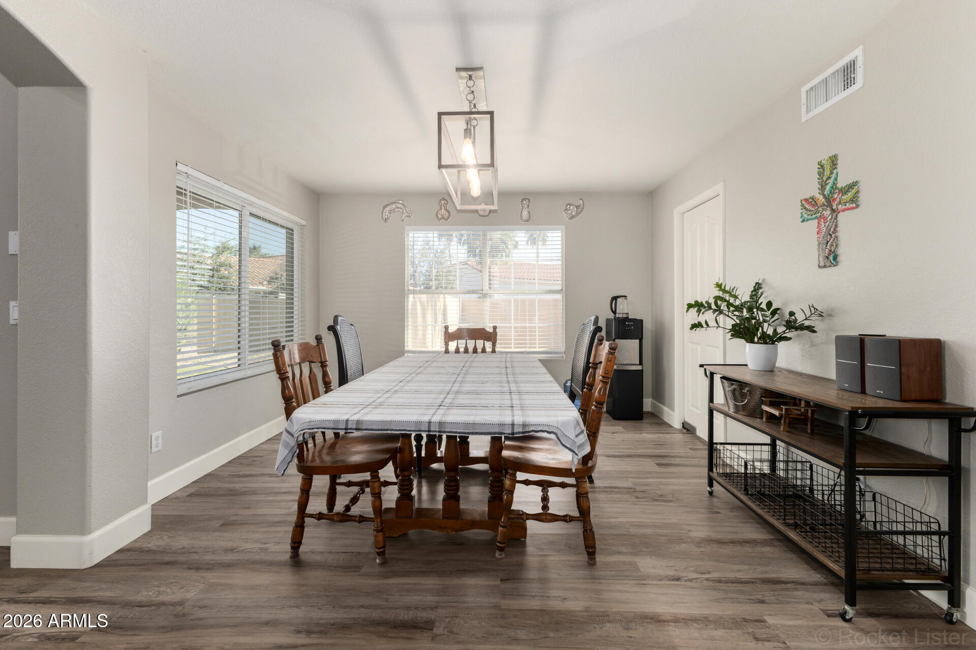 314 South Sandstone Street Gilbert, AZ 85296 - Photo 18 of 58 a view of a dining room with furniture window and wooden floor