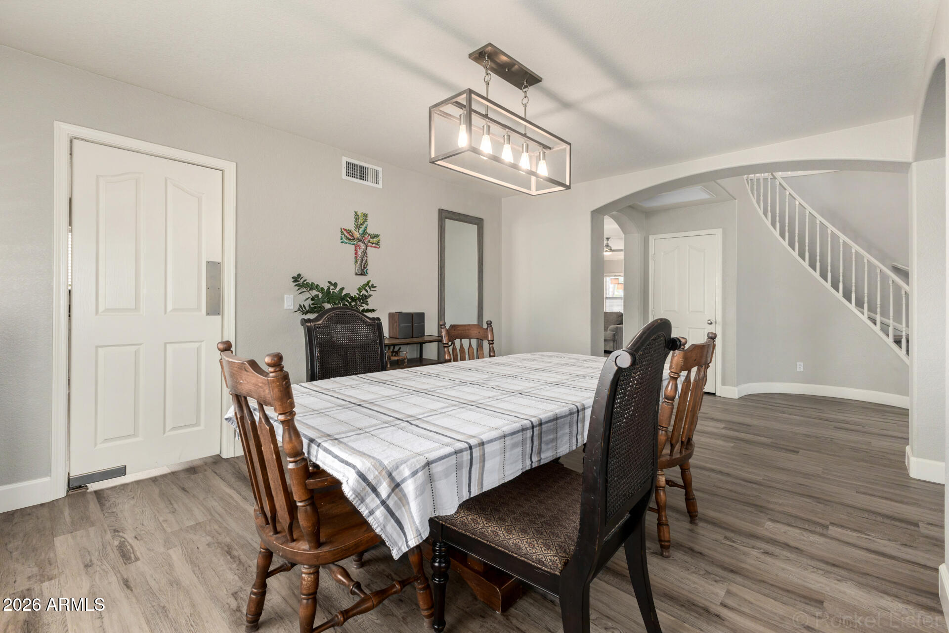 314 South Sandstone Street Gilbert, AZ 85296 - Photo 19 of 58 a view of a dining room with furniture and wooden floor