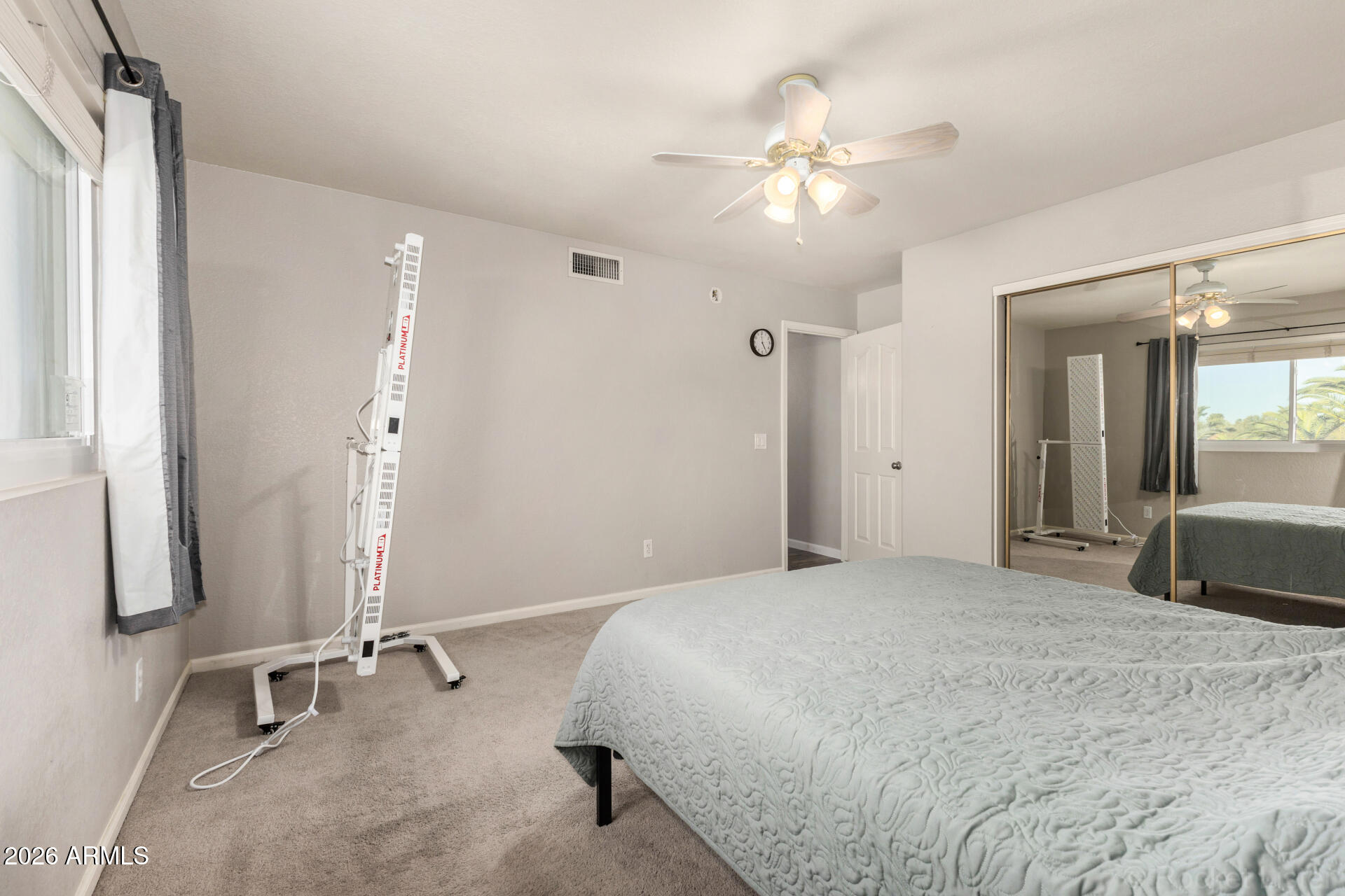 314 South Sandstone Street Gilbert, AZ 85296 - Photo 35 of 58 a spacious bedroom with a bed and a mirror