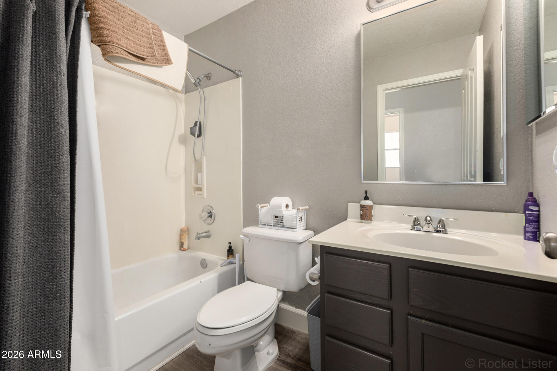 314 South Sandstone Street Gilbert, AZ 85296 - Photo 40 of 58 a bathroom with a sink a toilet and a mirror
