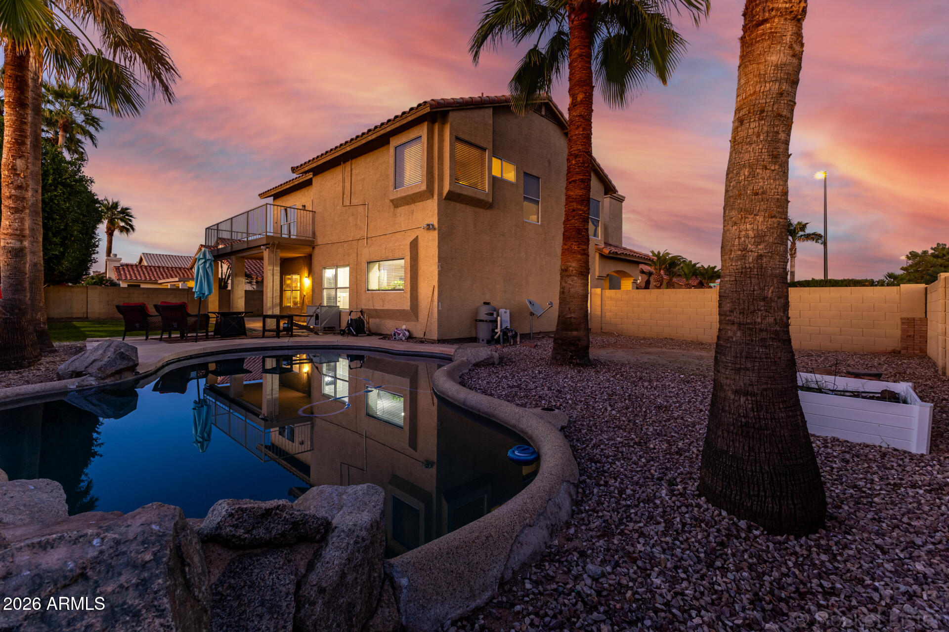 314 South Sandstone Street Gilbert, AZ 85296 - Photo 48 of 58 a front view of residential houses with outdoor space